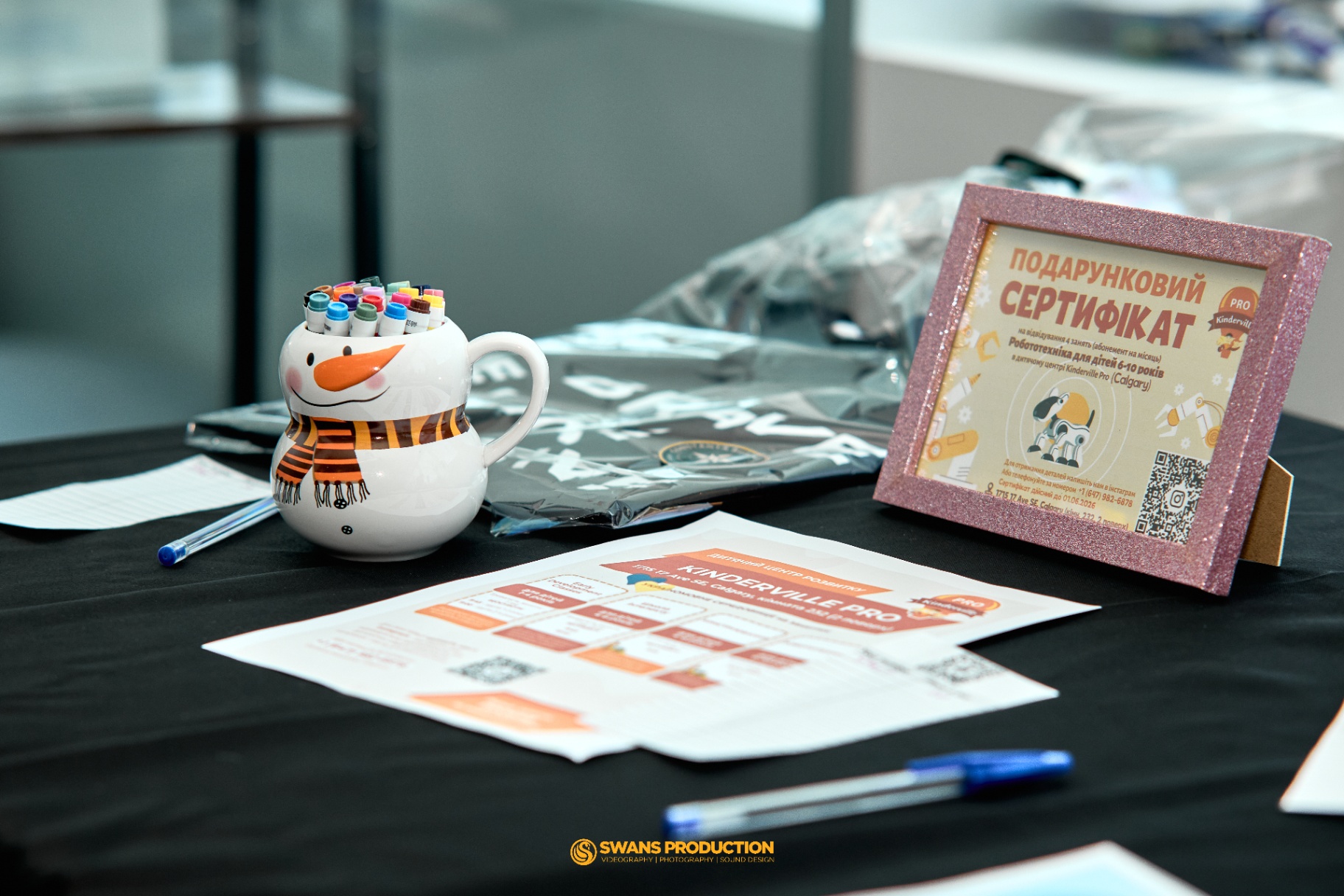 Donated gift certificates and items displayed at the silent auction table