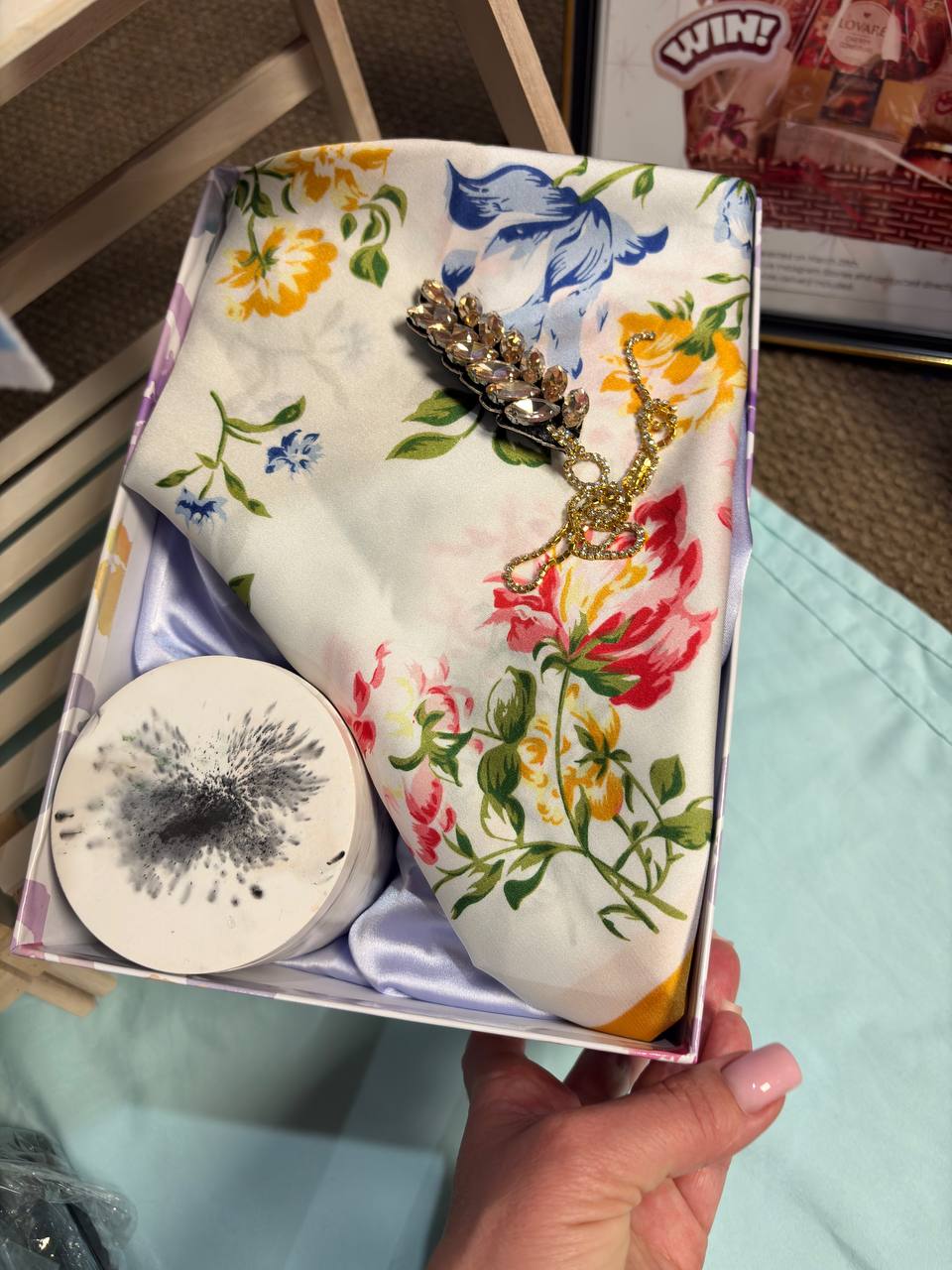 Phone photo of a floral gift box with accessories